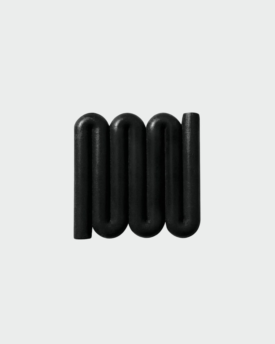 Black Bandy soap dish with sinuous, curved lines designed for optimal water flow and aeration, inspired by the Australian bandy-bandy snake.