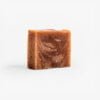 Organic banana, oats, and calendula soap with a warm, inviting appearance, perfect for dry and sensitive skin