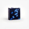 Artisanal soap with activated charcoal and vibrant blue accents, inspired by the pine forests of the Côte d’Azur