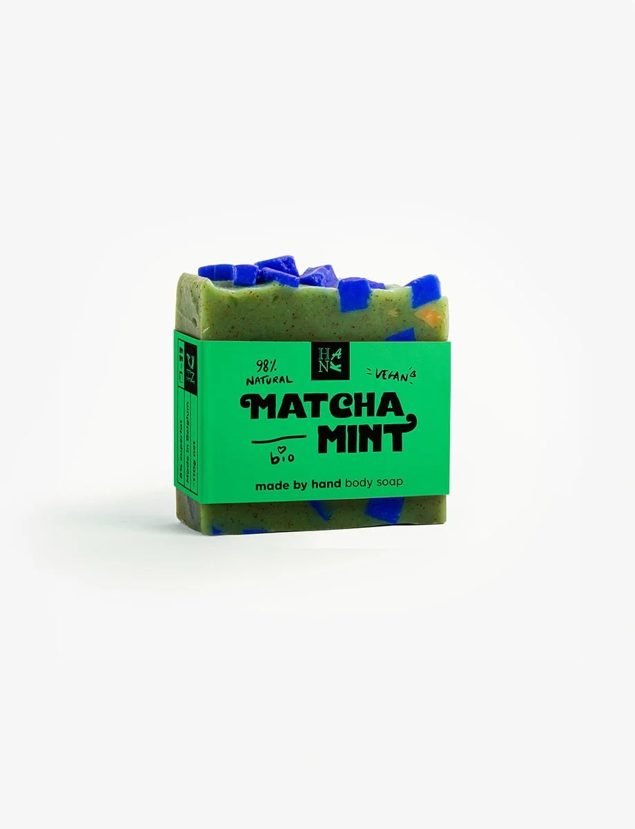 Handcrafted 'Matcha Mint' organic soap with real Matcha tea pieces, in refreshing shades of green with blue accents.
