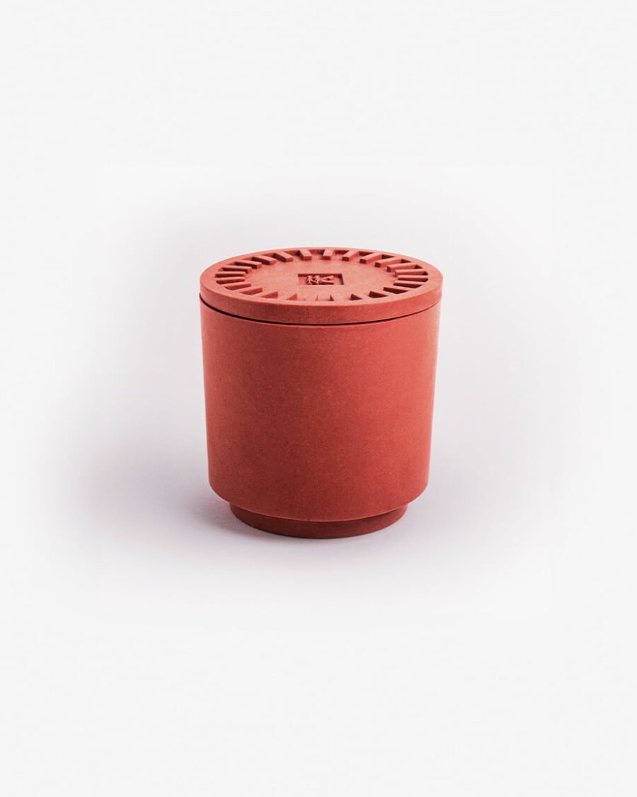 The ORIGINAL GANGSTA candle in a sleek red Jesmonite pot with matching saucer, featuring the unique scent of blue raspberry.