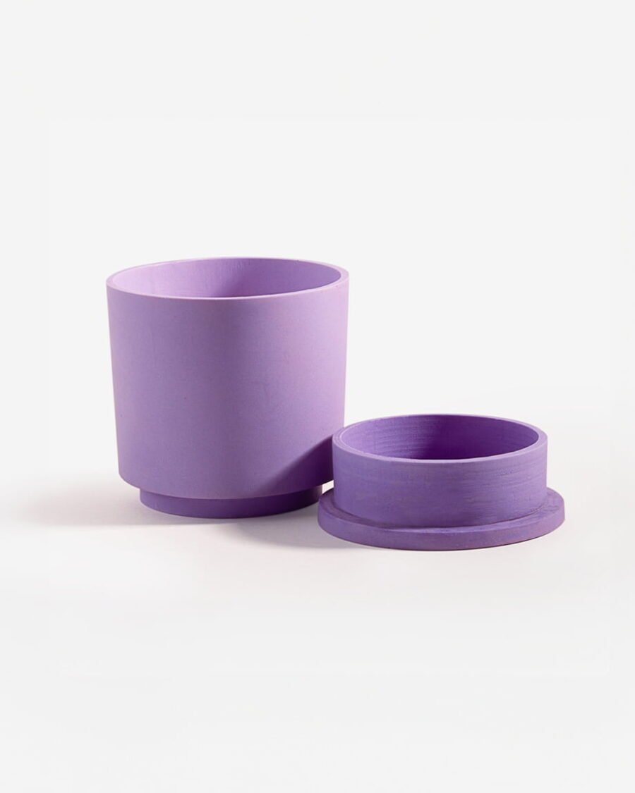 Elegant Purple Haze candle in a lavender-colored Jesmonite pot, offering a scent blend of fig leaf, black fig, and vetiver for a Mediterranean atmosphere