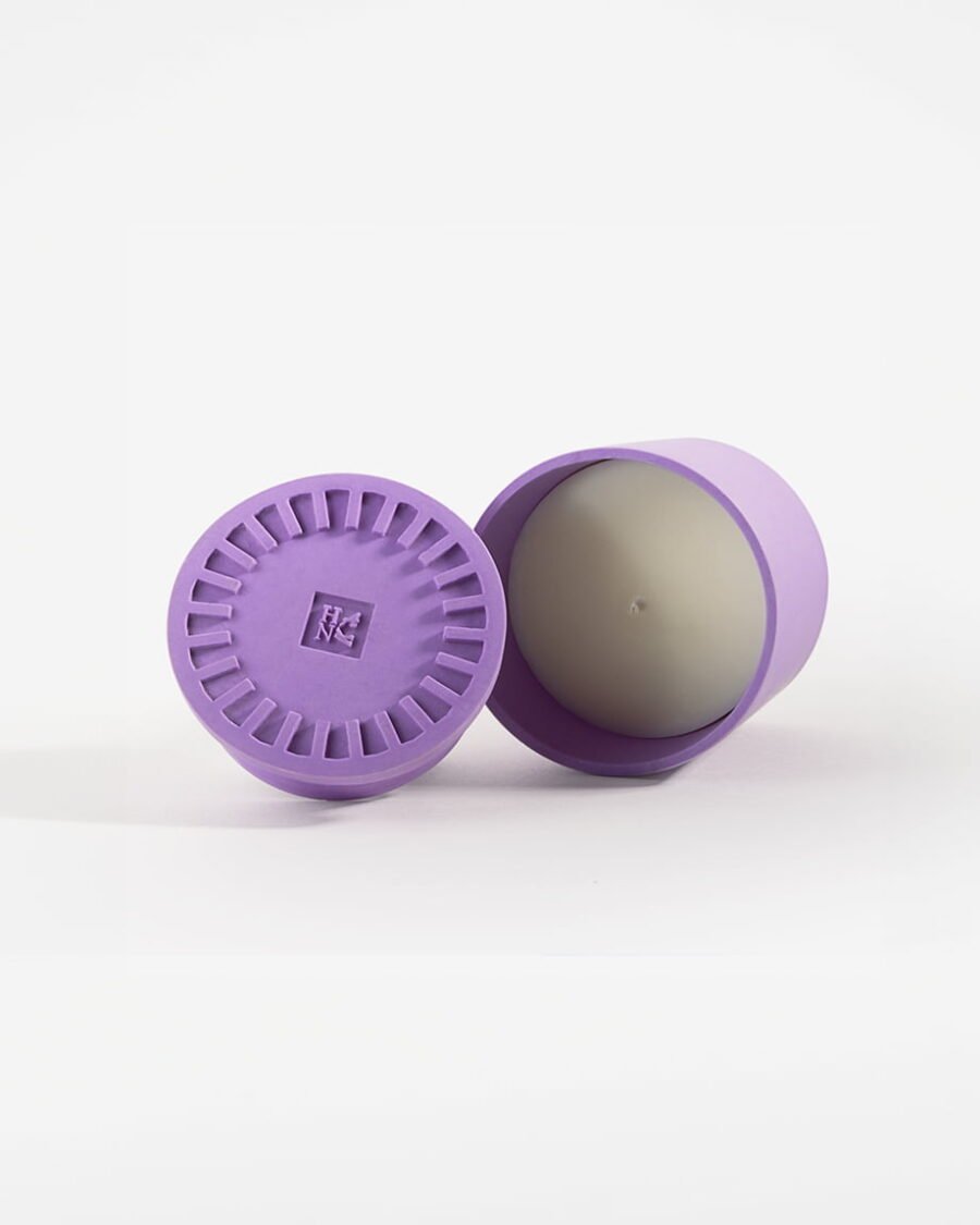 Elegant Purple Haze candle in a lavender-colored Jesmonite pot, offering a scent blend of fig leaf, black fig, and vetiver for a Mediterranean atmosphere