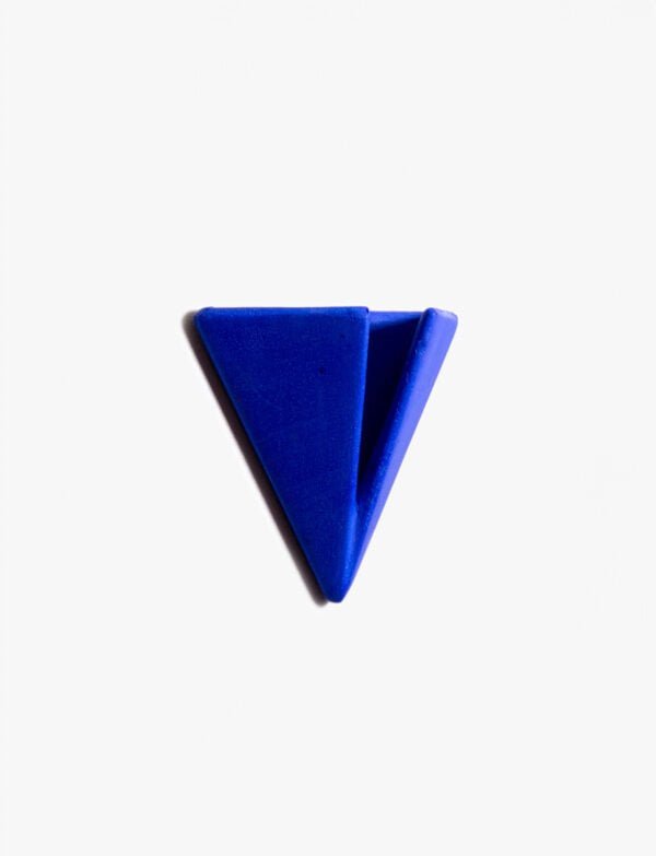 Bright Blue PAPERHANK wall hook inspired by the aerodynamic design of paper planes, offering a modern solution for hanging items.