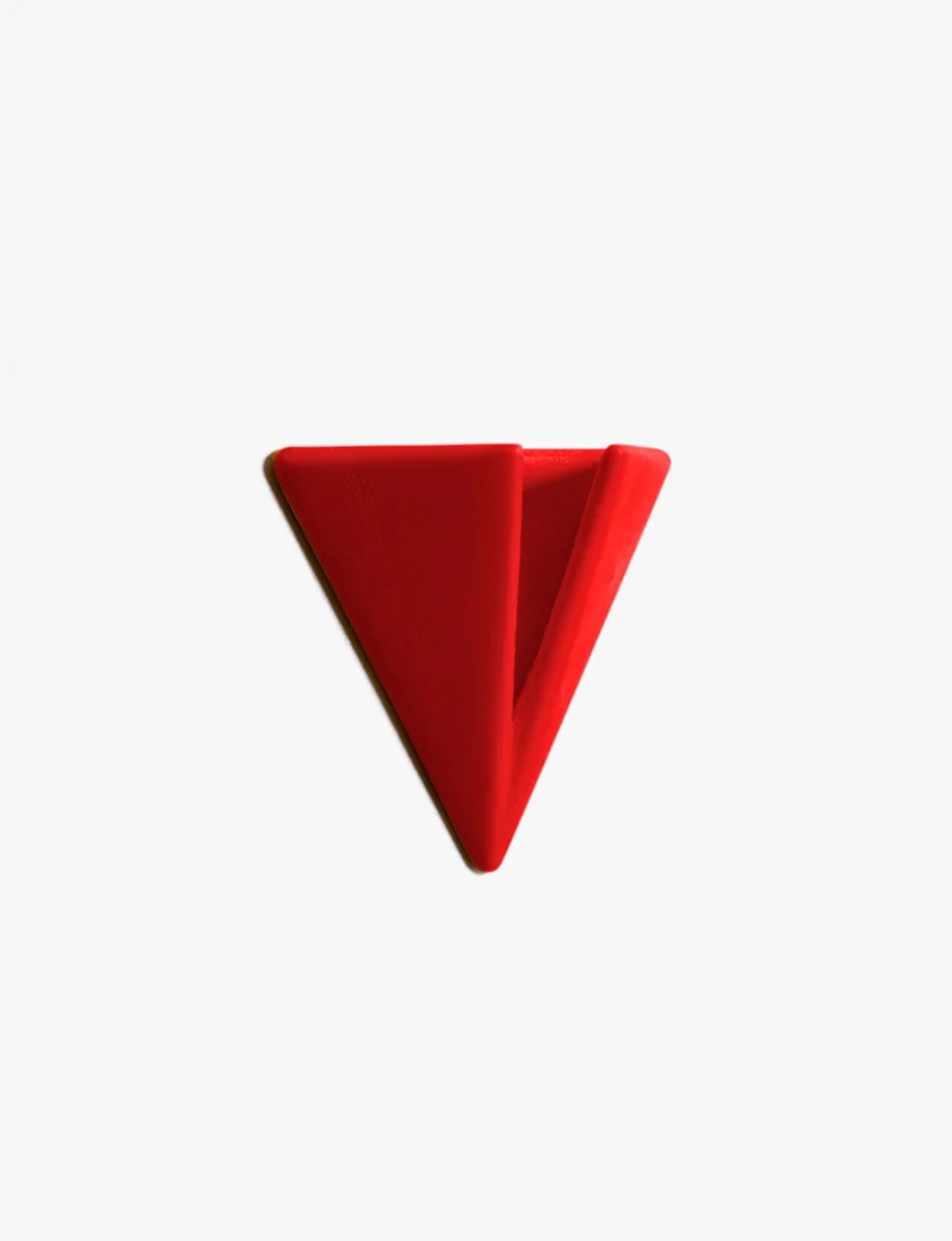 Bright Red PAPERHANK wall hook inspired by the aerodynamic design of paper planes, offering a modern solution for hanging items.