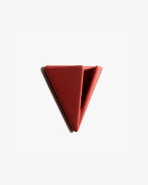 Terracotta PAPERHANK wall hook with a unique triangular design, offering a stylish and practical way to organize personal items