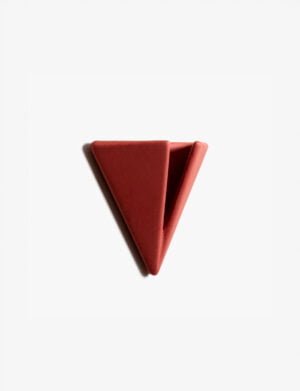Terracotta PAPERHANK wall hook with a unique triangular design, offering a stylish and practical way to organize personal items
