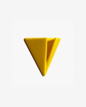 Bright yellow PAPERHANK wall hook inspired by the aerodynamic design of paper planes, offering a modern solution for hanging items.