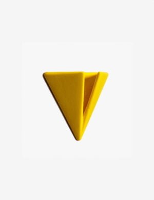 Bright yellow PAPERHANK wall hook inspired by the aerodynamic design of paper planes, offering a modern solution for hanging items.