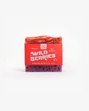 Handmade organic soap with swirls of crimson and purple, embedded with real cranberry and blueberry pieces for nourishing skincare.