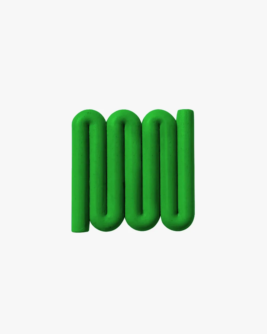 Grass green Bandy soap dish with sinuous, curved lines designed for optimal water flow and aeration, inspired by the Australian bandy-bandy snake.