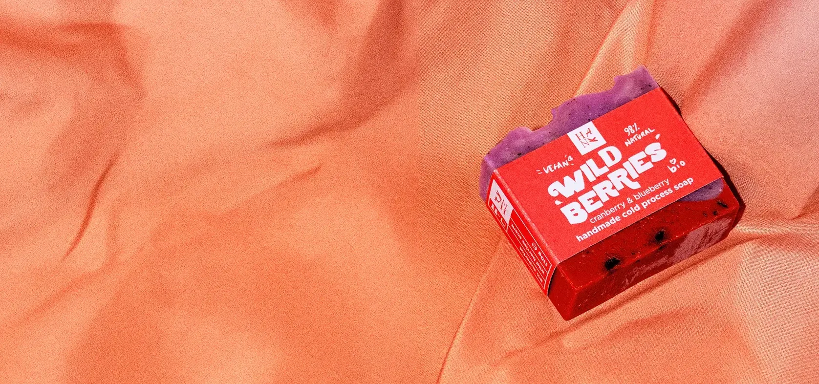 Wild berries shower LOW Photography of a Wild Berries bar soap by Hank. Handmade, cold processed soap on a shower curtain.